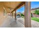 Relaxing covered patio with a fan overlooking the pool and backyard at 6442 American Eagle Ave, Las Vegas, NV 89131