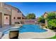 Backyard featuring a sparkling pool with lounge chairs and lush landscaping at 6442 American Eagle Ave, Las Vegas, NV 89131