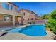 Sparkling pool with lush landscaping, lounge chairs, and private patio at 6442 American Eagle Ave, Las Vegas, NV 89131