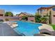 Inviting backyard pool with elegant water features and mature landscaping at 6442 American Eagle Ave, Las Vegas, NV 89131