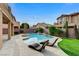 Private backyard pool, lounge chairs, landscaped yard, and space for outdoor activities at 6442 American Eagle Ave, Las Vegas, NV 89131