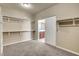 Walk-in closet featuring rods and shelving, with an entrance to the ensuite bathroom at 6442 American Eagle Ave, Las Vegas, NV 89131