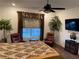 Relaxing bedroom seating area with natural light and comfortable chairs at 6756 Millbury St, North Las Vegas, NV 89086