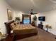 Cozy bedroom with ceiling fan, television, and coordinated furnishings at 6756 Millbury St, North Las Vegas, NV 89086