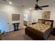 Spacious bedroom with coordinated bedding and ensuite bathroom access at 6756 Millbury St, North Las Vegas, NV 89086