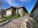 Charming single-story home featuring an attached two-car garage and low-maintenance landscaping in front at 6756 Millbury St, North Las Vegas, NV 89086