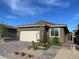 Charming single-story home showcasing an attached two-car garage and low-maintenance landscaping in front at 6756 Millbury St, North Las Vegas, NV 89086