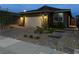 Charming single-story home at night with an attached two-car garage and low-maintenance landscaping at 6756 Millbury St, North Las Vegas, NV 89086
