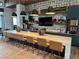 Community kitchen with quartz counters and modern stools at 6756 Millbury St, North Las Vegas, NV 89086
