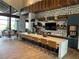 Community kitchen with quartz counters, cabinetry and modern stools at 6756 Millbury St, North Las Vegas, NV 89086