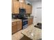 Close up view of the kitchen showcasing stainless steel appliances and neutral color backsplash at 6756 Millbury St, North Las Vegas, NV 89086
