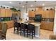 Spacious kitchen featuring a center island, pendant lighting, stainless steel appliances and ample storage at 6756 Millbury St, North Las Vegas, NV 89086