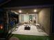 Comfortable patio features an outdoor seating area and view through the sliding glass door at 6756 Millbury St, North Las Vegas, NV 89086
