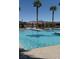 Community pool with lounge chairs and desert mountain views at 6756 Millbury St, North Las Vegas, NV 89086