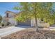 Attractive home featuring a two-car garage and desert landscaping at 7705 Granberg Ct, Las Vegas, NV 89131