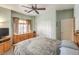 Bedroom with neutral walls, carpet, closet, and window with curtains at 7824 Homing Pigeon St, North Las Vegas, NV 89084