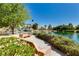 Beautiful community lake with cascading waterfall, walking paths, lush greenery, and a serene atmosphere at 7824 Homing Pigeon St, North Las Vegas, NV 89084