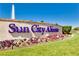 Sun City Aliante community sign with vibrant flowers and water feature at 7824 Homing Pigeon St, North Las Vegas, NV 89084