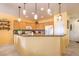 Bright kitchen with light wood cabinets, granite countertops, and modern appliances at 7824 Homing Pigeon St, North Las Vegas, NV 89084