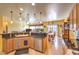 Well-appointed kitchen with granite countertops, wooden cabinets, tiled flooring, and an open layout at 7824 Homing Pigeon St, North Las Vegas, NV 89084
