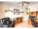 Office space features hardwood floors, chair, natural light, and shelving at 7824 Homing Pigeon St, North Las Vegas, NV 89084