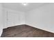 Bedroom features a roomy closet, hardwood floors, base molding, and simple decor at 7950 W Flamingo Rd # 2019, Las Vegas, NV 89147