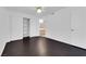 Clean bedroom features dark wood floors, closet with shelving and bathroom view at 7950 W Flamingo Rd # 2019, Las Vegas, NV 89147