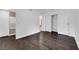 Bright bedroom featuring hardwood floors, a closet with sliding doors, and an ensuite bathroom at 7950 W Flamingo Rd # 2019, Las Vegas, NV 89147