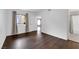 Bedroom features dark hardwood floors, window, a large closet, and view to the Primary bathroom at 7950 W Flamingo Rd # 2019, Las Vegas, NV 89147