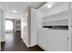 Convenient laundry room with washer, dryer, and shelving for storage at 7950 W Flamingo Rd # 2019, Las Vegas, NV 89147