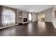 Spacious living room with fireplace, dark wood floors, archway architectural detail and lots of natural light at 7950 W Flamingo Rd # 2019, Las Vegas, NV 89147