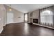 Inviting living room with cozy fireplace, dark wood floors, and abundant natural light creating an inviting space at 7950 W Flamingo Rd # 2019, Las Vegas, NV 89147