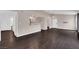 Bright living area featuring seamless flow with dark wood floors, connecting living spaces with natural light at 7950 W Flamingo Rd # 2019, Las Vegas, NV 89147