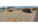 Expansive backyard featuring gravel, perfect for low-maintenance landscaping and RV parking at 804 Cherry Dr, Henderson, NV 89002