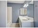 Bathroom boasts double sinks with a large mirror and tiled shower/tub combo at 804 Cherry Dr, Henderson, NV 89002