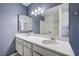 Bathroom boasts double sinks with a large mirror and tiled shower/tub combo at 804 Cherry Dr, Henderson, NV 89002