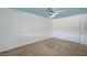 Spacious bedroom with ceiling fan and neutral carpeting provides a calming atmosphere at 804 Cherry Dr, Henderson, NV 89002