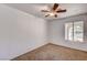Empty bedroom with carpet flooring and a wood-blade ceiling fan at 804 Cherry Dr, Henderson, NV 89002