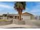 Charming single-story home with a lush palm tree, a two-car garage, and a well-kept front yard at 804 Cherry Dr, Henderson, NV 89002
