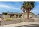 Inviting single-story home with a large palm tree and a well-maintained front yard at 804 Cherry Dr, Henderson, NV 89002
