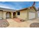 Side view of a single-story house with a two-car garage and drought-tolerant landscaping at 804 Cherry Dr, Henderson, NV 89002