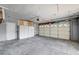 Spacious garage with storage cabinets and an insulated garage door offers secure parking at 804 Cherry Dr, Henderson, NV 89002