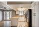 Well-lit kitchen features light countertops, stainless steel appliances, and backyard access at 804 Cherry Dr, Henderson, NV 89002