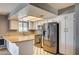 Updated kitchen with stainless steel appliances, white cabinets, and tile flooring at 804 Cherry Dr, Henderson, NV 89002
