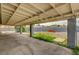 Covered patio area with plenty of space for seating, entertaining, and enjoying the backyard at 804 Cherry Dr, Henderson, NV 89002