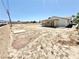 Spacious backyard featuring an enclosed patio, offering potential for landscaping and outdoor activities at 810 E Calvada Blvd, Pahrump, NV 89048