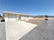 Ranch style home with a two-car garage and low maintenance landscaping at 810 E Calvada Blvd, Pahrump, NV 89048