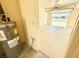 This garage features a Rheem water heater with visible energy guide information for efficient performance at 810 E Calvada Blvd, Pahrump, NV 89048