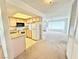 Cozy kitchen featuring basic appliances and an open layout to the living area at 810 E Calvada Blvd, Pahrump, NV 89048