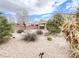 Backyard oasis featuring rock landscaping and native desert plants, ideal for outdoor living at 8161 Cane Creek Mill Ct, Las Vegas, NV 89131